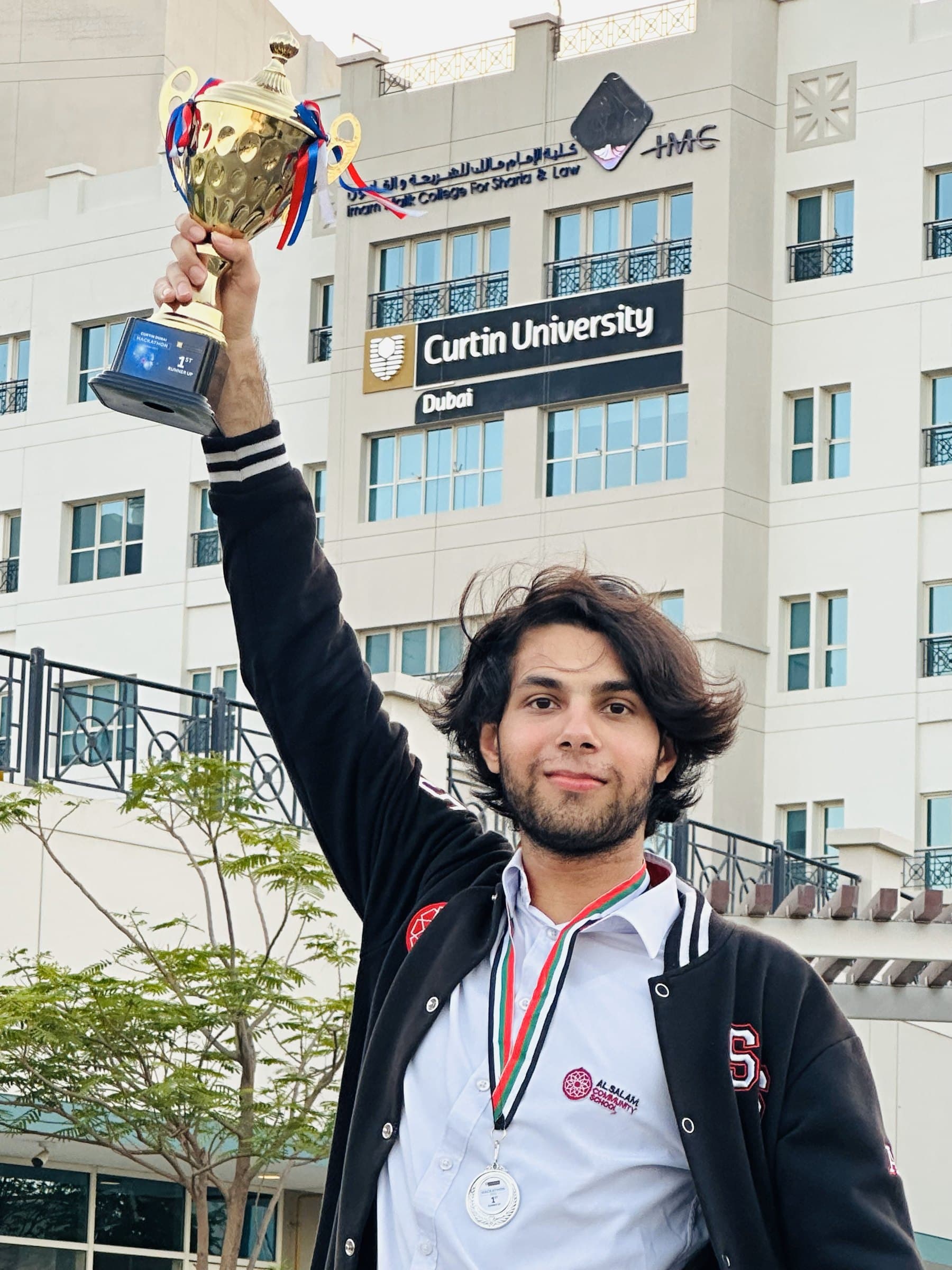 Trophy in hand, university hackathon, Curtin University Dubai